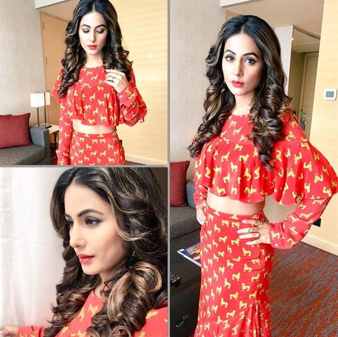 Hina Khan's curls just always melt our hearts. She looks pretty in red dress with red lips.