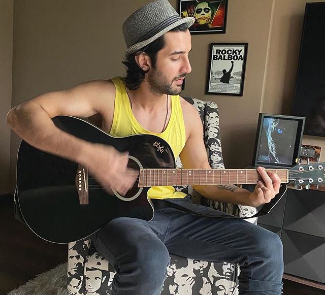 Aditya Seal with a guitar