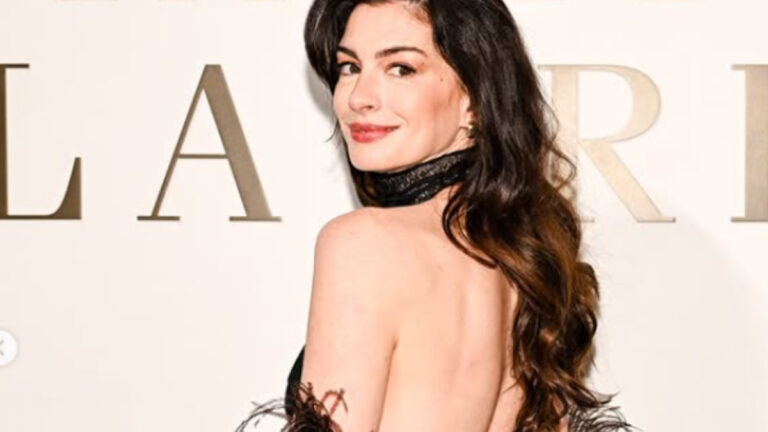 Anne Hathaway Receives Special Gift From Fan At Premiere